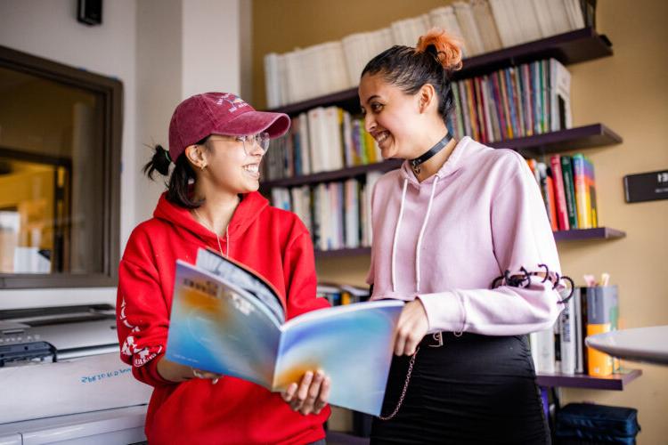 Two students reading MetroSphere